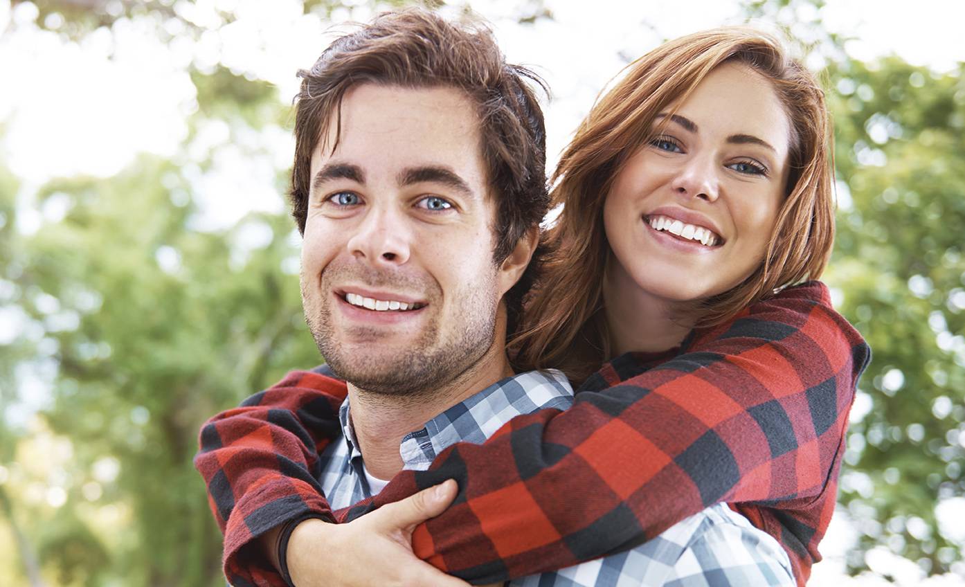 Two adults hugging